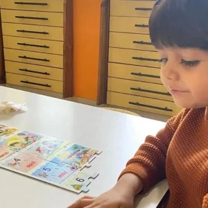 montessori-child-learning-months-of-year-calendar-puzzle